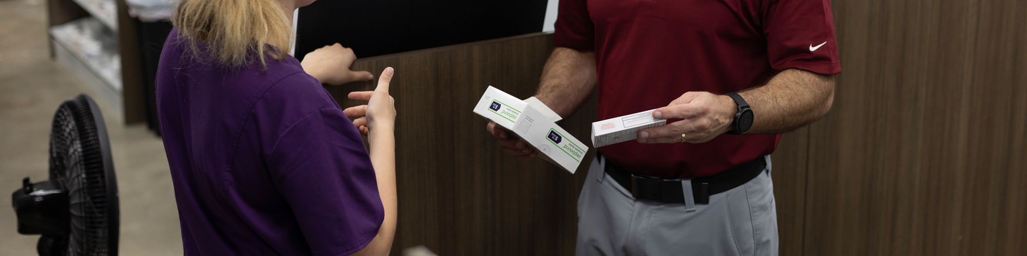 People With Boxes Of Medical Items